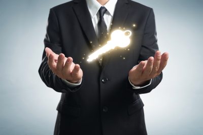 Image of man with golden key above hands in Executive Recruitment
